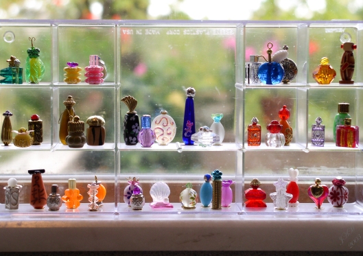 Miniature perfume bottles made from beads and jewelry findings.